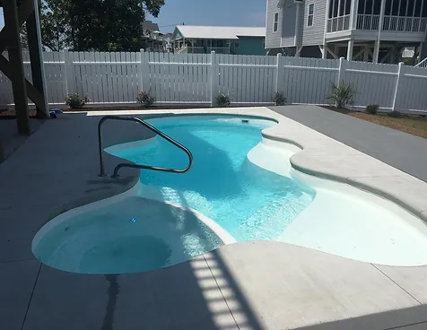 Transform your backyard with the elegant Dolphin San Juan fiberglass pool, installed by Able Pools and Spas.