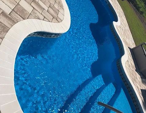 Transform your backyard with the Cocoa Beach San Juan fiberglass pool, installed by Able Pools and Spas.