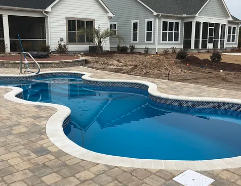 Enhance your outdoor space with the spacious Dallas San Juan fiberglass pool, installed by Able Pools and Spas.