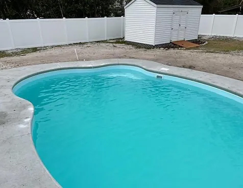 Experience the luxury of the Olympus w/ Spa San Juan pool, installed by Able Pools and Spas.
